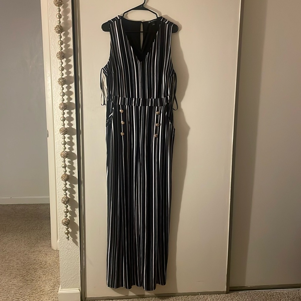 Black and white striped jumpsuit with gold buttons